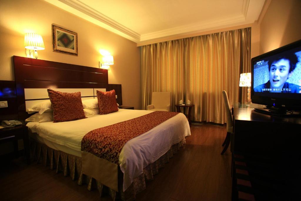 Overseas Chinese International Hotel Čching-tao Pokoj fotografie