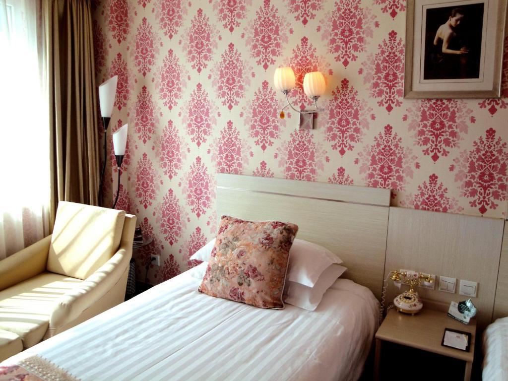 Overseas Chinese International Hotel Čching-tao Pokoj fotografie